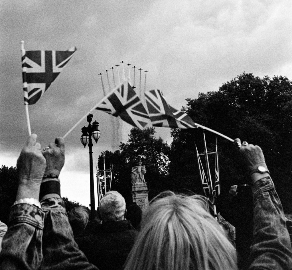 Flypast: The Red Arrows fly past Buckingham Palace.