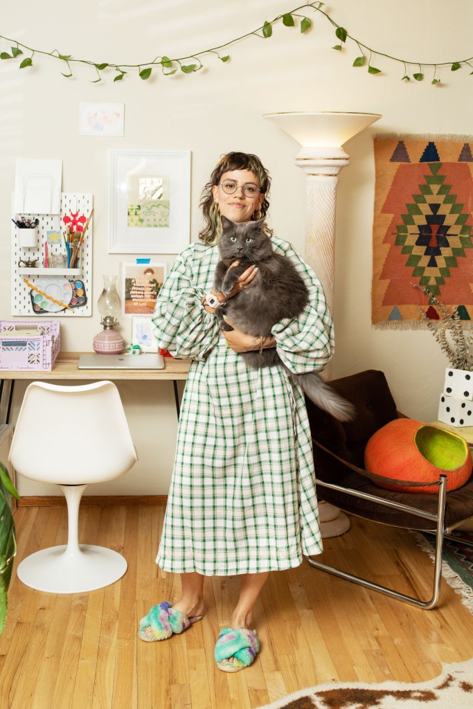 A woman holding a cat