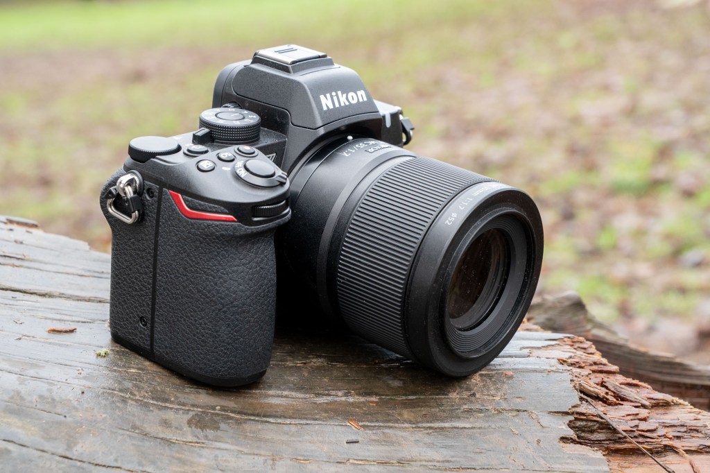 The Nikkor 35mm Macro lens attached to a Nikon Z50 II on a log