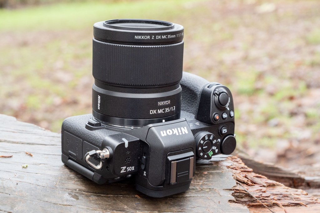 The Nikkor 35mm Macro lens attached to a Nikon Z50 II on a log