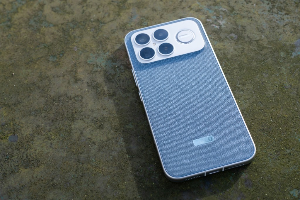 The Poco F8 Ultra on a green surface