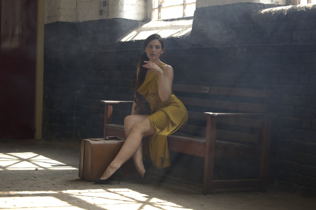portrait ol a woman in a yellow dress edited in Affinity by Canva