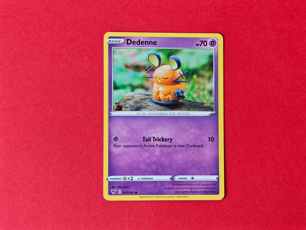 A Dedenne Pokemon card, with artwork by Yuka Morii