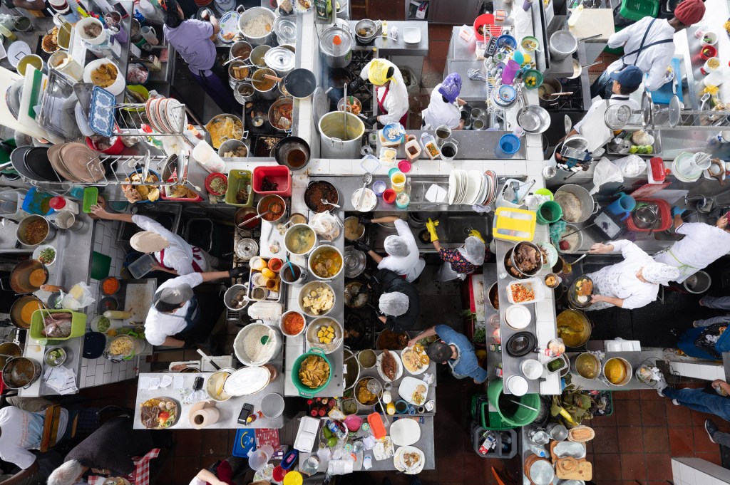photo from above of a busy restaurant kitchen