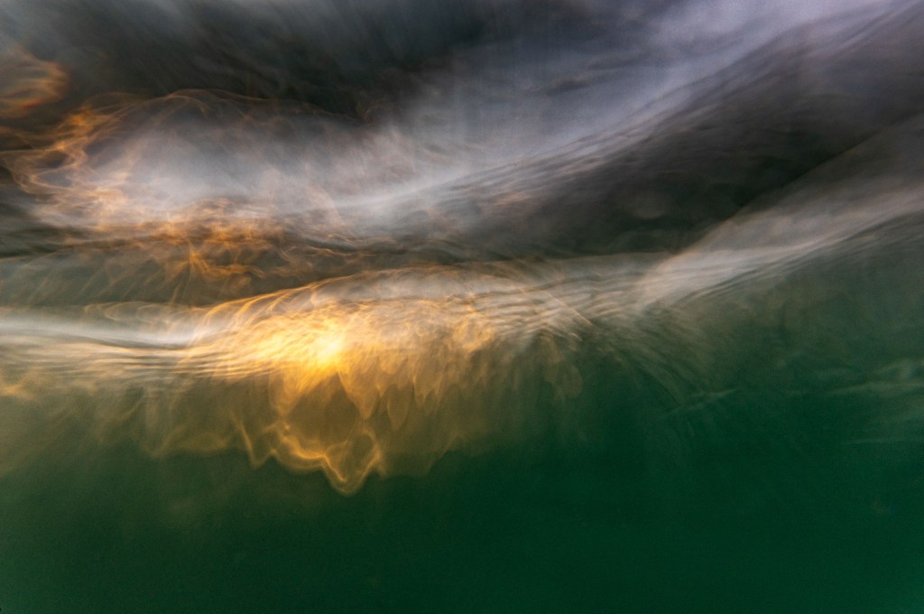 Using a waterproof housing enables Bill to allow the water to wash over his camera, producing an unusual perspective of lapping waves
