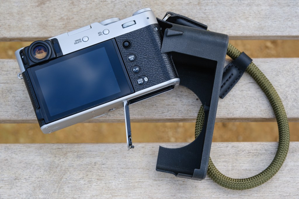 Akara Labs Slim Skin Case for the Fuijfilm X100VI partially removed for battery access