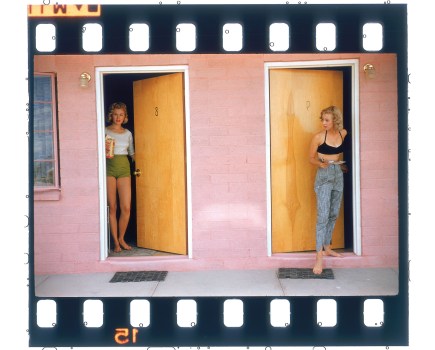 two girls standing by the doors