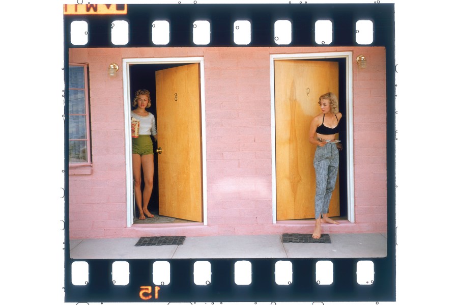two girls standing by the doors