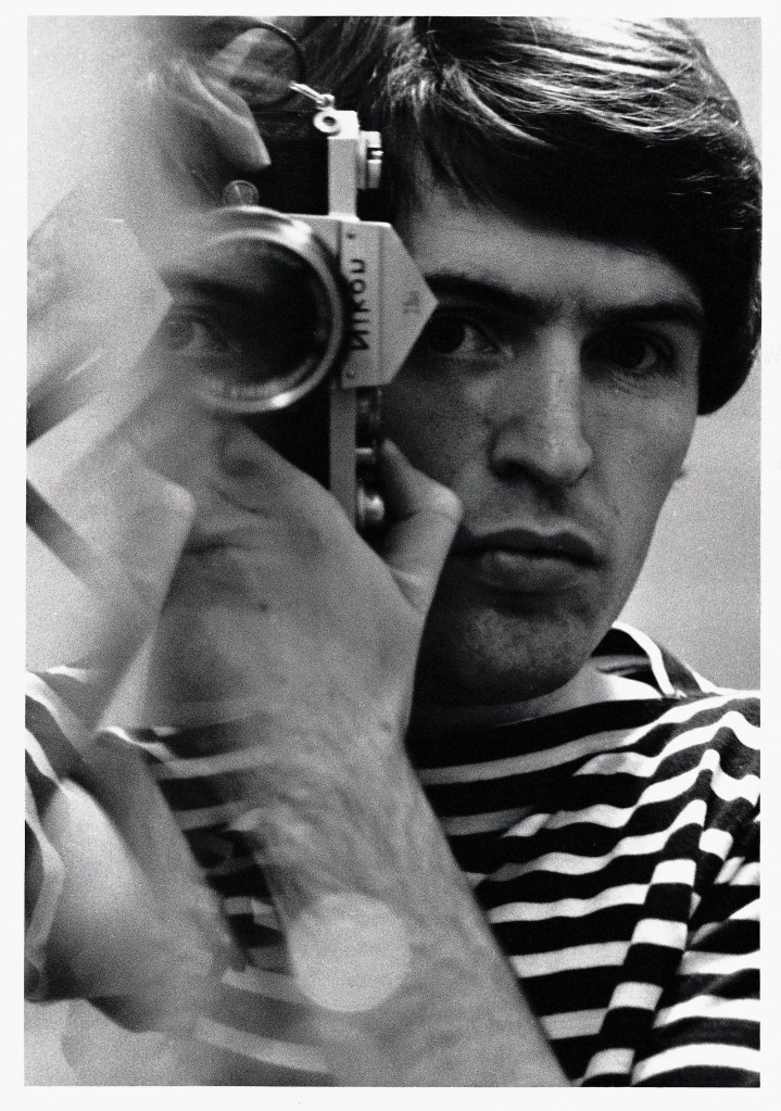 Mike McCartney with a Nikon camera, self-portrait. © Mike McCartney