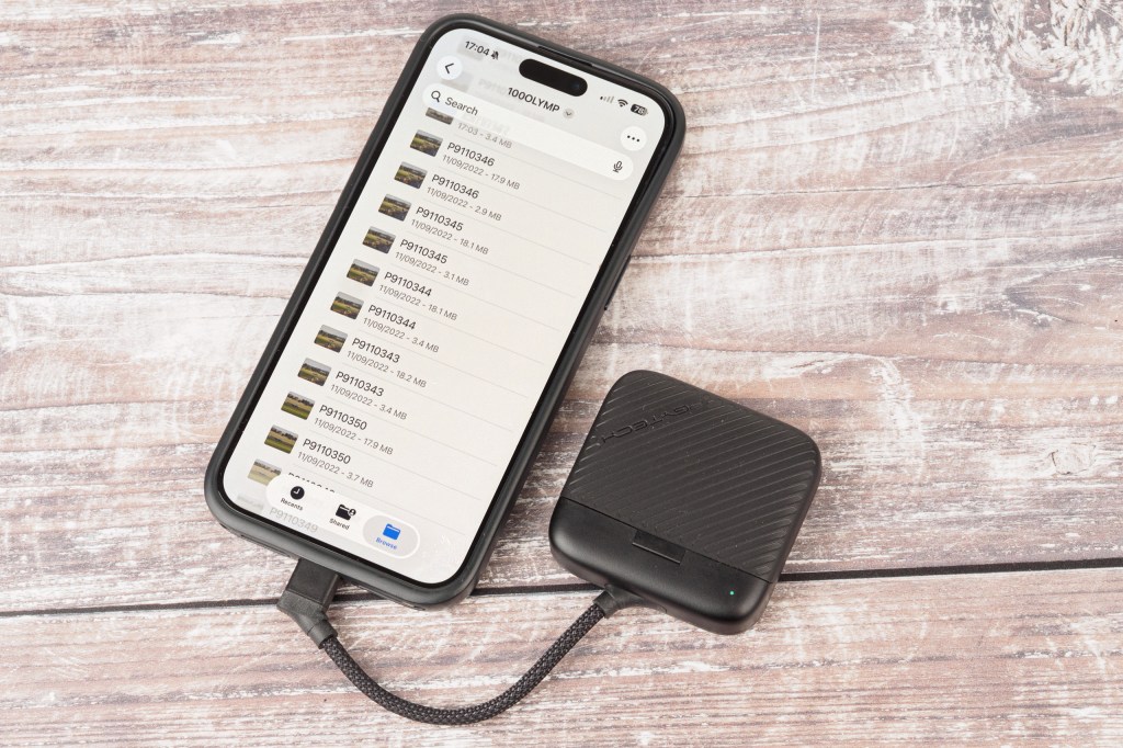 PGYTech CreateMate High-Speed Mini Card Reader Case connected to iPhone.