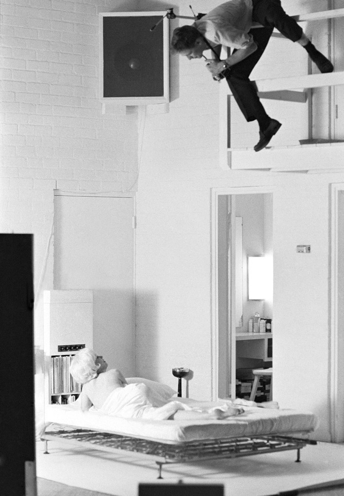 A photo of Kirkland photographing Marilyn Monroe