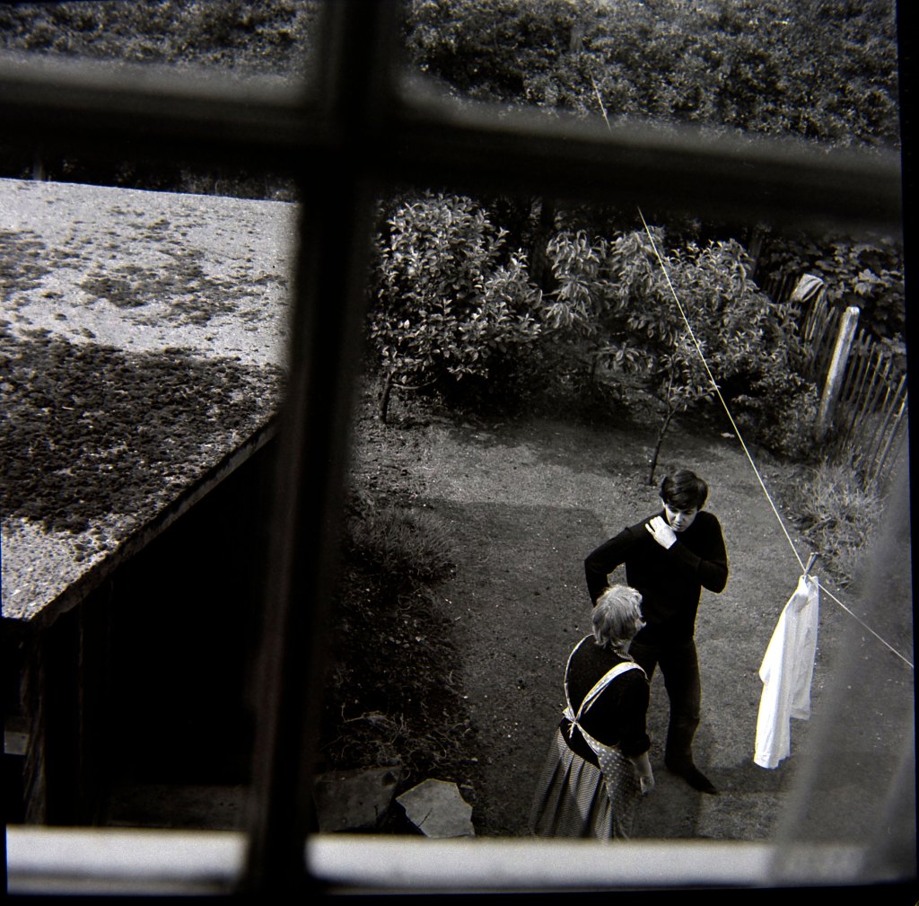 Paul McCartney and housekeeper Nora in Forthlin Road garden, July 1962.© Mike McCartney