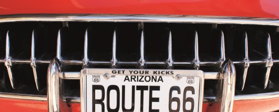 The front grille of a classic red 1957 Chevrolet Corvette