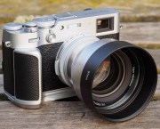 Viltrox TCL-X100VI with hood on Fujifilm X100VI with Neewer handgrip