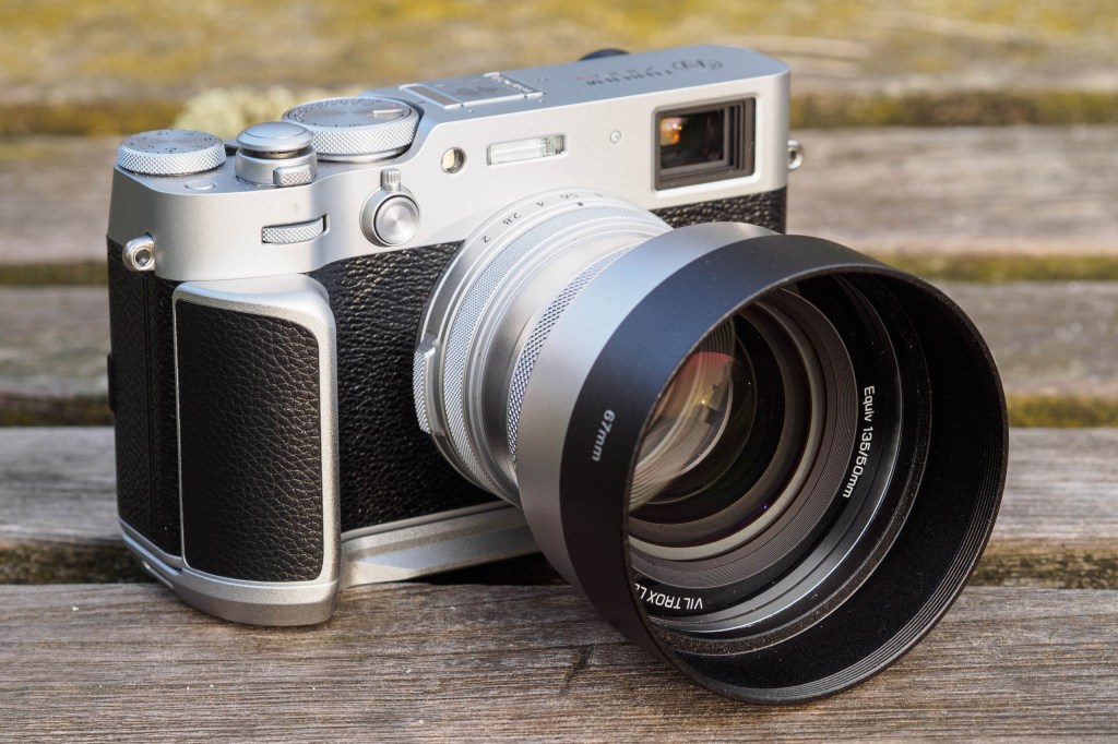 Viltrox TCL-X100VI with hood on Fujifilm X100VI with Neewer handgrip
