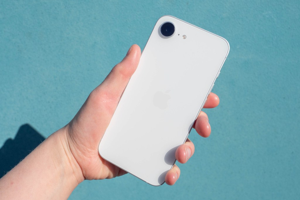An iPhone 17e in front of a turquoise background