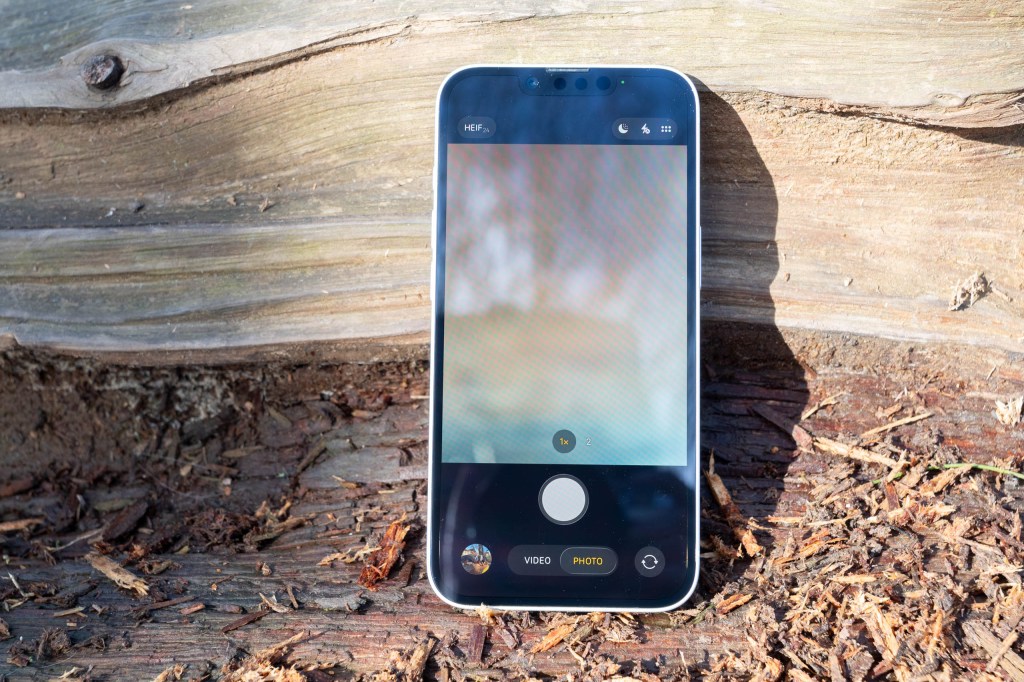 iPhone 17e with the native camera app showing on screen