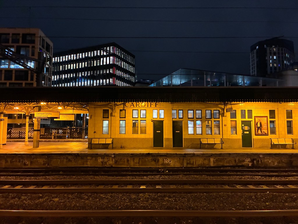 A sample image taken with the iPhone 17e showing a railway station after dark
