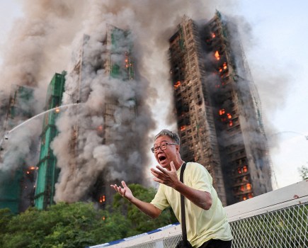 Mr Wong cries out in anguish as fire engulfs the Tai Po housing complex he calls home. Moments earlier, he phoned his wife, who was trapped in the building, and they exchanged what would be their final words. Hong Kong, 26 November 2025.