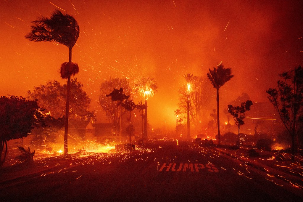 The Palisades Fire ravages a neighborhood amid high winds. The Los Angeles blazes inflicted between $28 and $53.8 billion in property damage, disrupting thousands of local businesses. Los Angeles, California, United States, 7 January 2025.