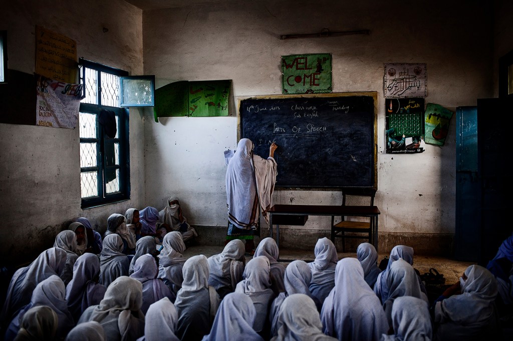 Female students attend class at their school, which was attacked by the Taliban on 21 December 2012 as part of a campaign to prevent girls from accessing education. Swabi, Khyber Pakhtunkhwa, Pakistan, 4 June 2013.