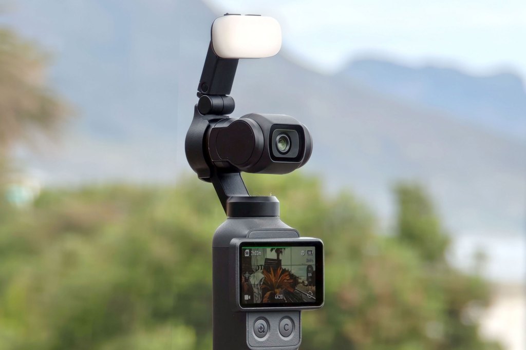 DJI Osmo Pocket 4 product photo with fill light accessory attached