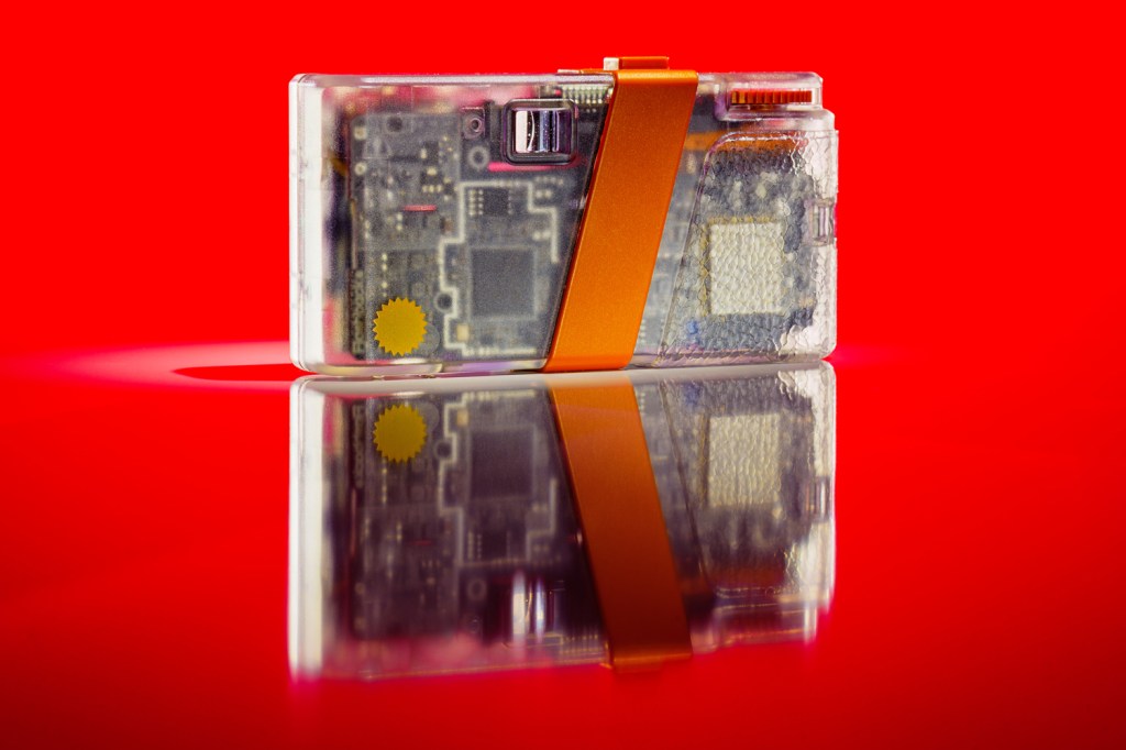 Flashback ONE35 camera against red background rear view