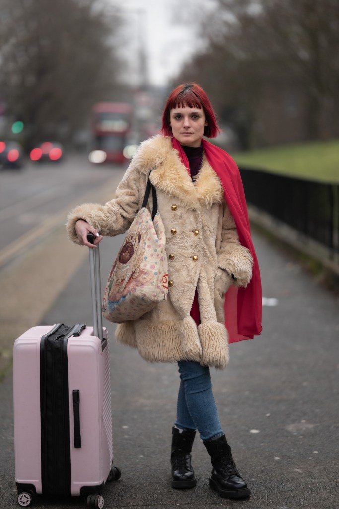 Portrait of a person wearing a beige coat