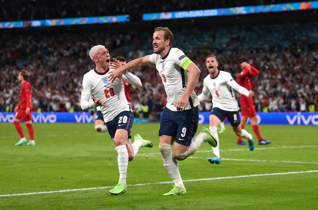 LONDON, ENGLAND - JULY 07: Harry Kane of England is congratulated by Phil Foden after scoring the second goal during the UEFA Euro 2020 Championship Semi-final match between England and Denmark at Wembley Stadium on July 07, 2021 in London, England. Image Credit: Laurence Griffiths/Getty Images
