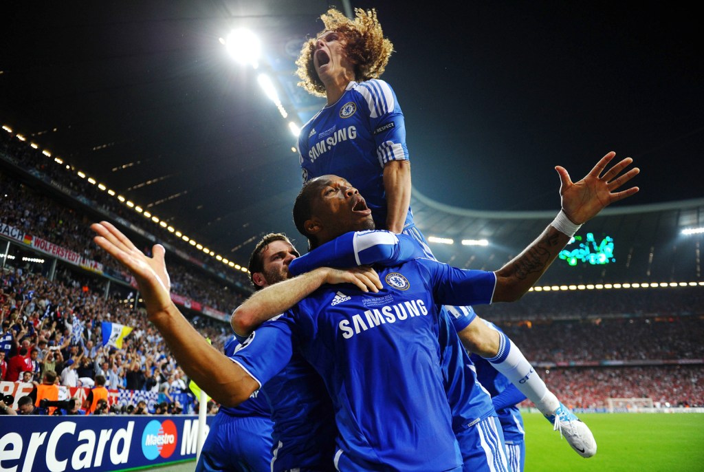 MUNICH, GERMANY - MAY 19: Didier Drogba of Chelsea celebrates with team mates after scoring his team’s first goal during UEFA Champions League Final between FC Bayern Muenchen and Chelsea at the Fussball Arena München . Image Credit: Laurence Griffiths/Getty Images