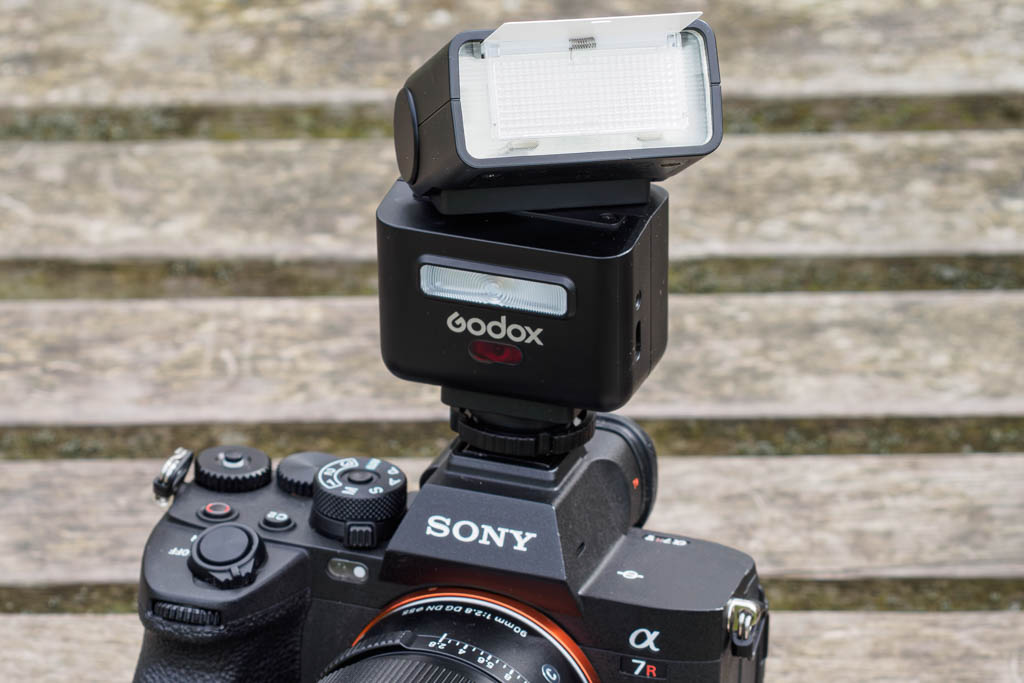 Godox iT32 with wide panel in place and catchlight reflector card