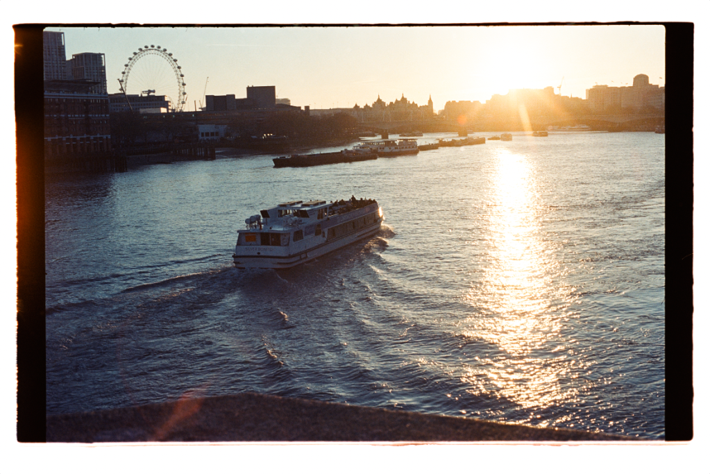 Photograph of boat travelling along the River Thames at sunset, taken on Kodak Vision T