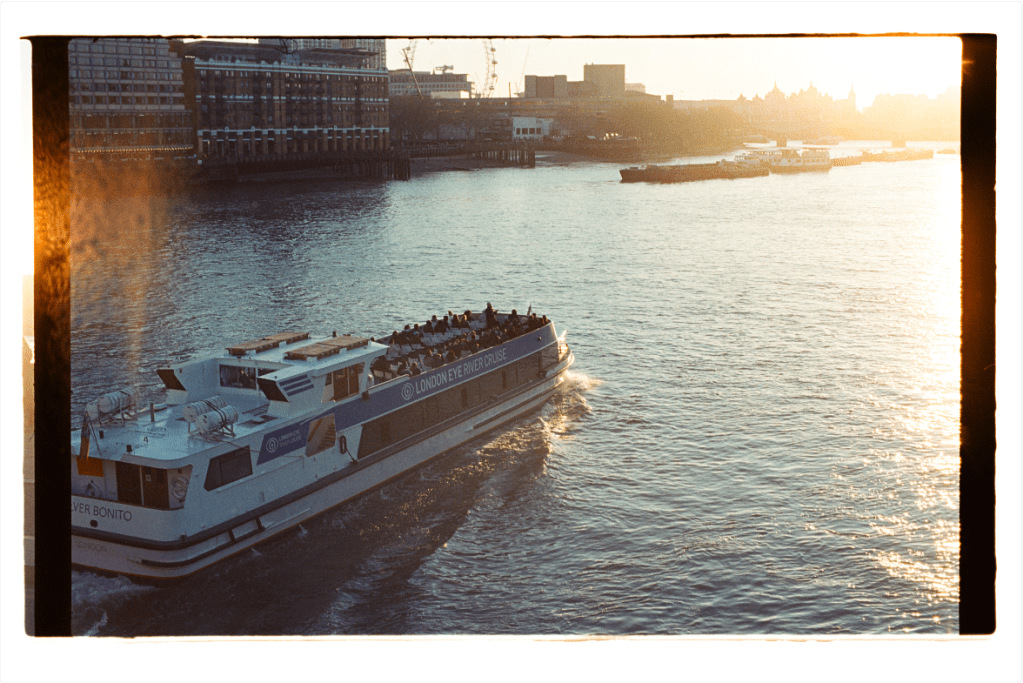 Photograph of boat travelling along the Thames at sunset, taken on Kodak Vision T film