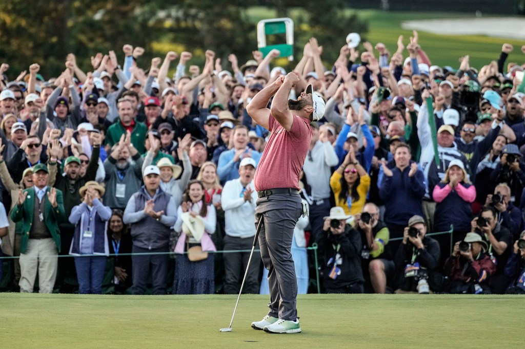 Jon Rahm celebrates on the 18th green of the Masters in 2023