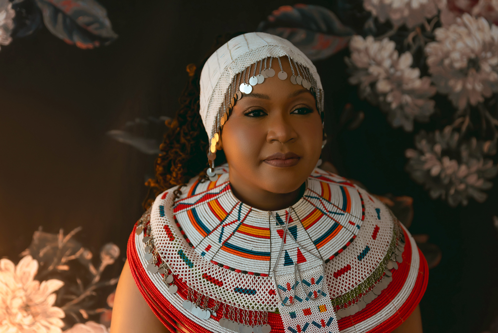 portrait of woman with beaded neckpiece