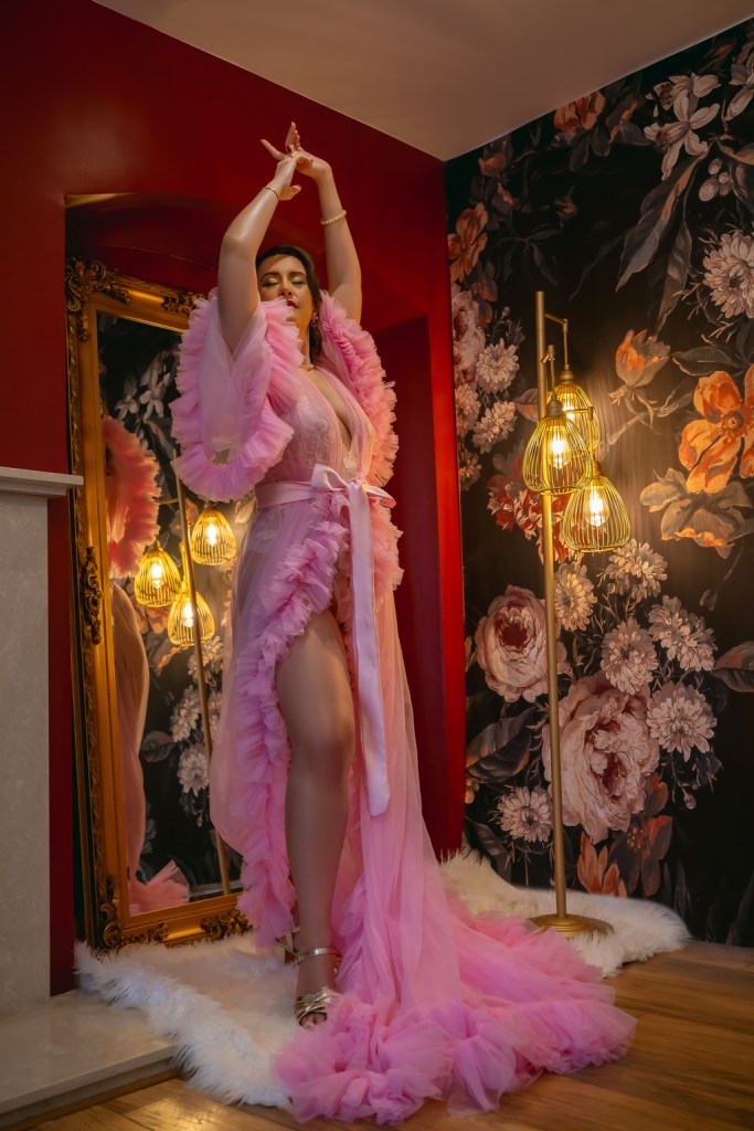 Portrait of a woman in pink bedroom robe