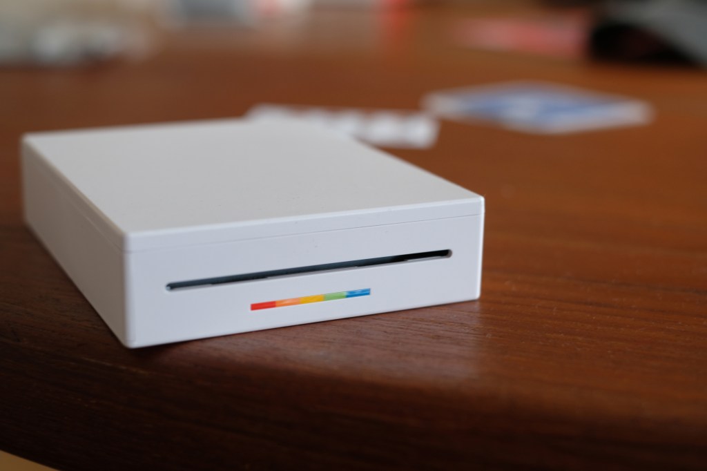 Photograph of Polaroid Hi-Print 3x3 printer printing slow