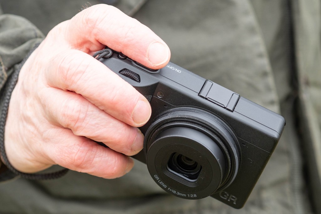Ricoh GR IV Monochrome in-hand.