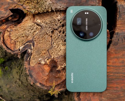 The Xiaomi 17 Ultra on a wooden log