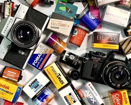 Photograph showing rolls of film and analogue cameras