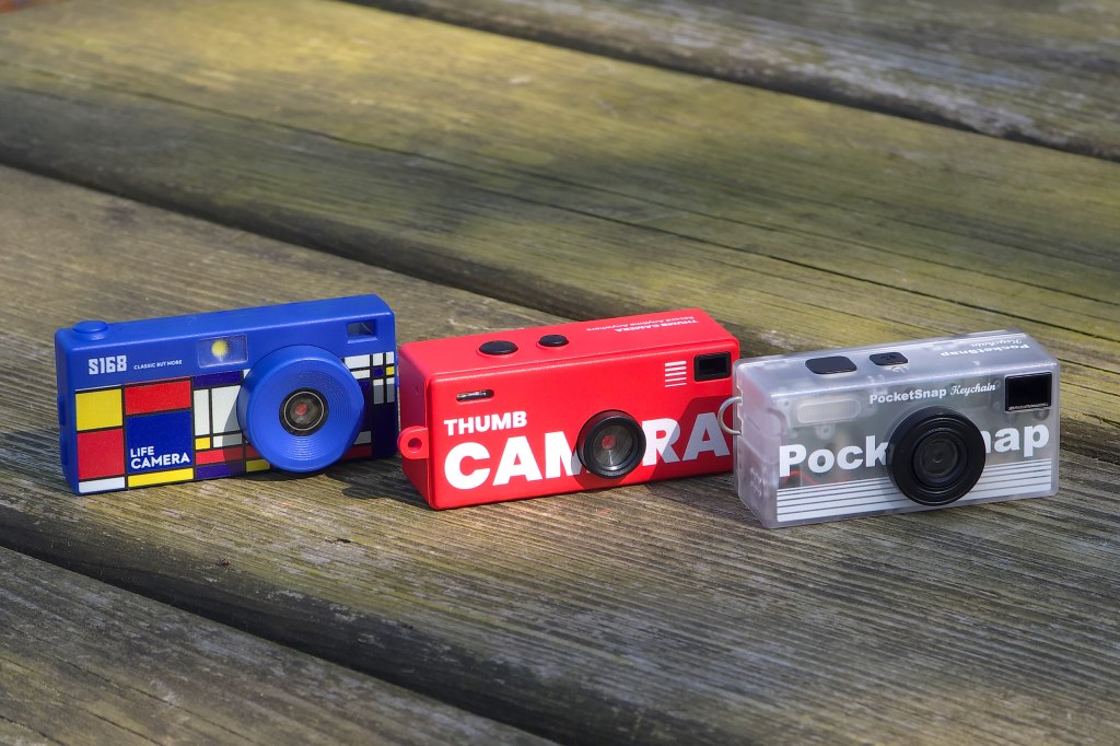 From left to right: Life Camera S168, Thumb Camera G6, PocketSnap. Image copyright Joshua Waller / AP