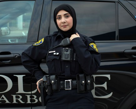 portrait of a muslim american policewoman in uniform