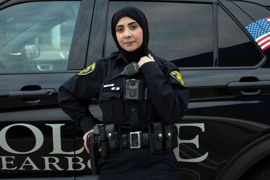 portrait of a muslim american policewoman in uniform