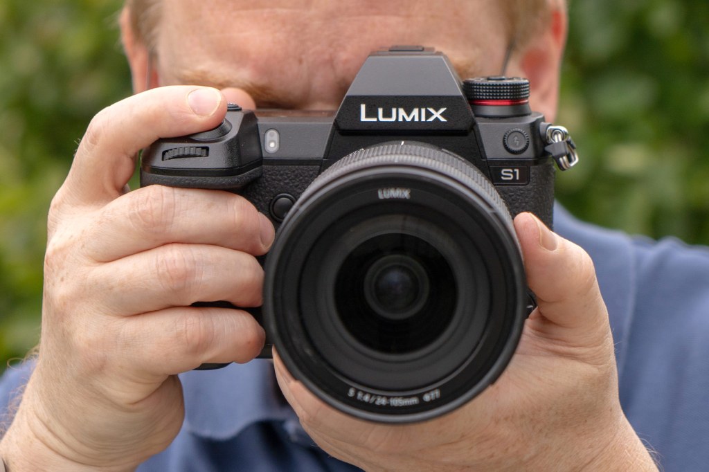 Panasonic Lumix S1 in hand. Photo Andy Westlake