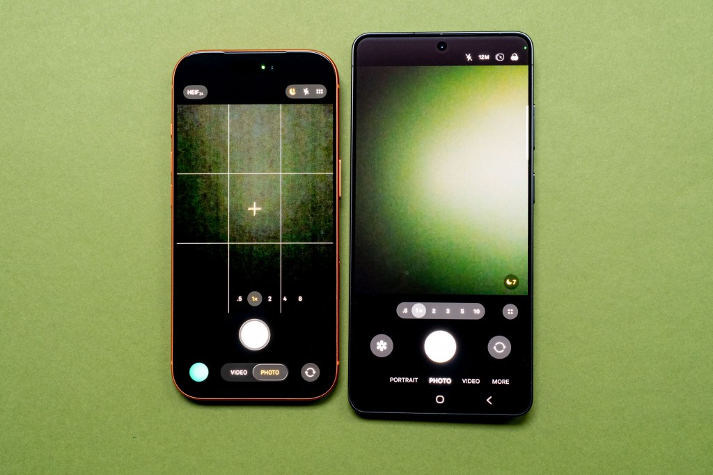 The iPhone 17 Pro next to the Samsung Galaxy S26 Ultra, showing the native camera apps on each
