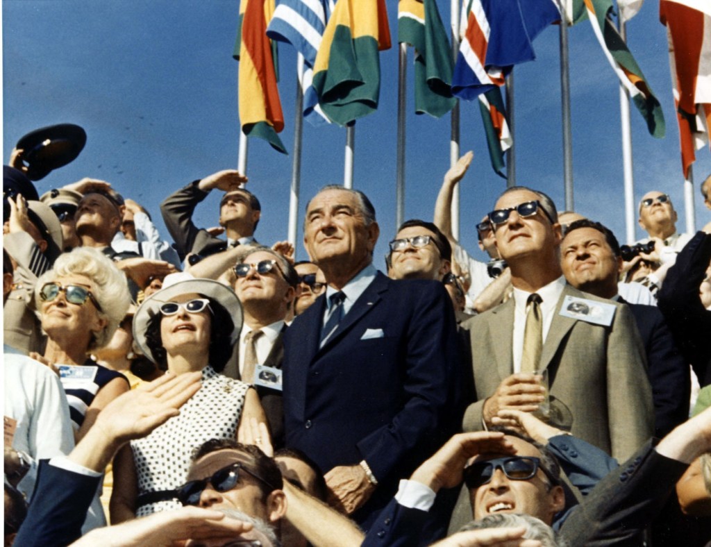 Lady Bird Johnson, former President Lyndon Johnson and Vice President Spiro Agnew watch the lift-off of Apollo 11, the first crewed lunar landing mission, from the Kennedy Space Center at 9.32 a.m. local time on 16 July 1969