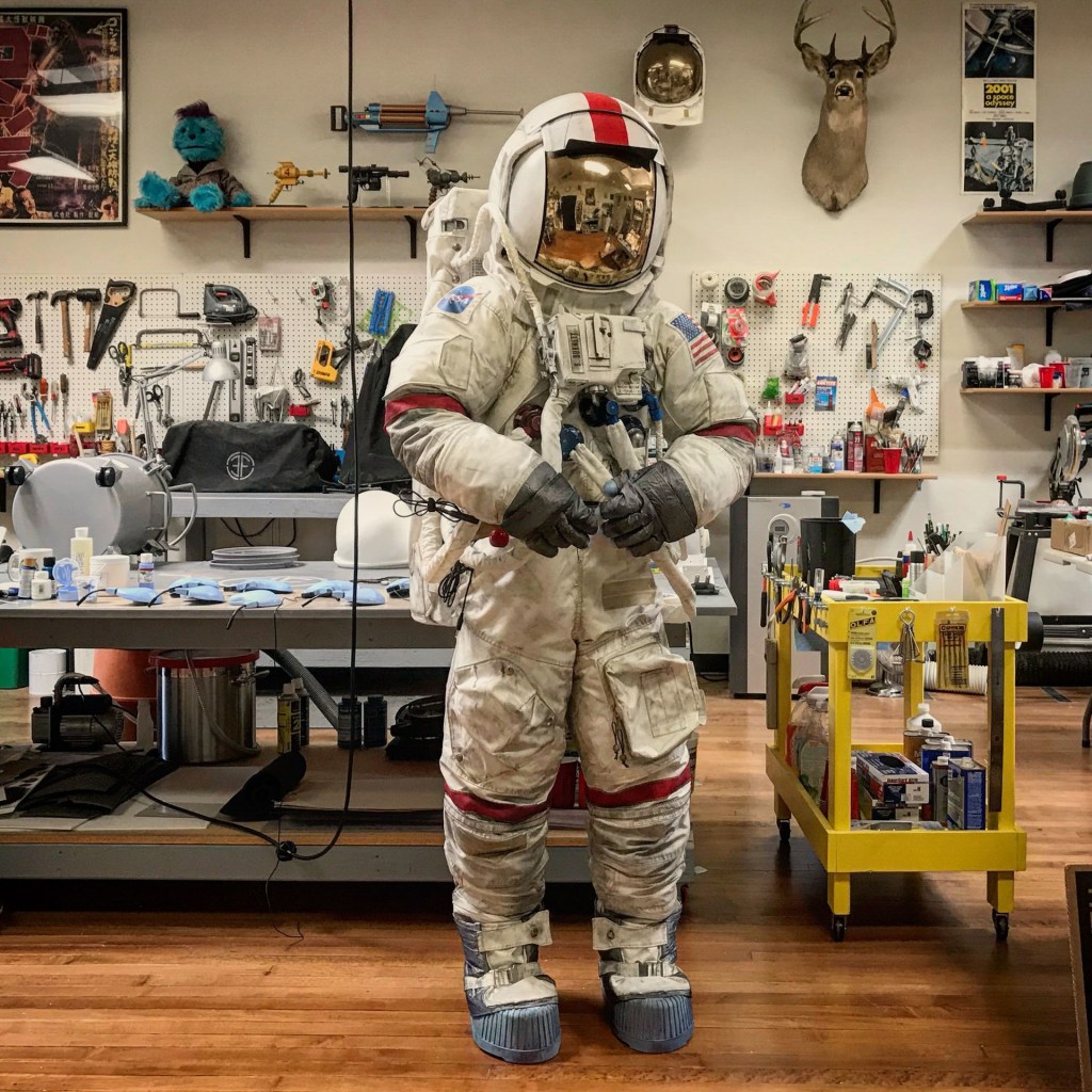 Ryan Nagata modelling his high-fidelity replica of an Apollo A7L-B spacesuit in his workshop