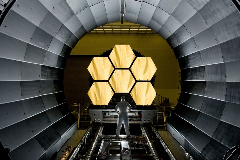 James Webb Space Telescope. NASA engineer Ernie Wright looks on as the first six flight-ready primary mirror segments are prepped to begin final cryogenic testing at NASA's Marshall Space Flight Center in 2011. This represents the first six of 18 segments that will form NASA's James Webb Space Telescope’s primary mirror for space observations