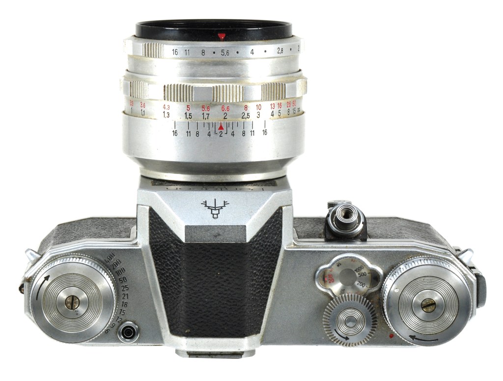 Top plate of the Pentacon showing the unusual shutter speed controls and, around the rewind knob on the left, a handy film speed reminder
