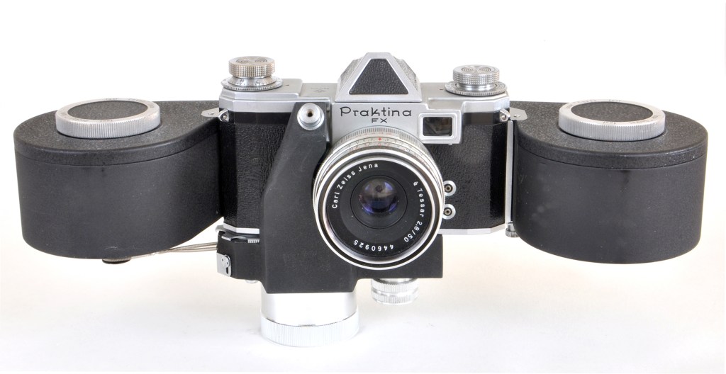 Praktina FX with eye-level pentaprism viewfinder, clockwork motor drive and film back for 450 exposures